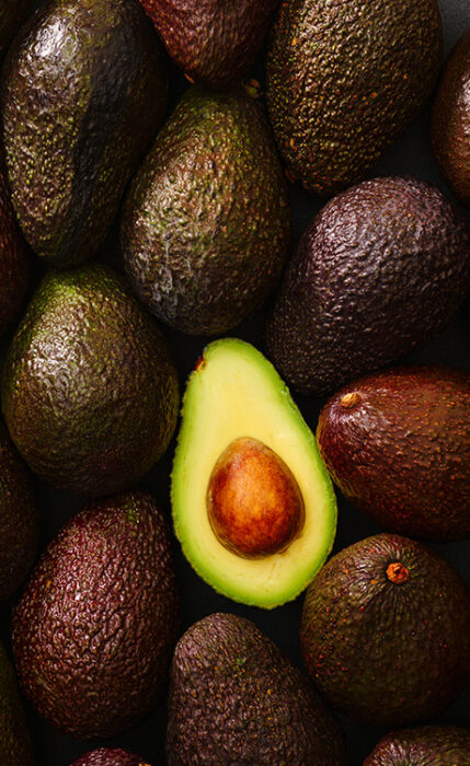 donnelly fresh Avocados, a pile of avocados with one sliced open